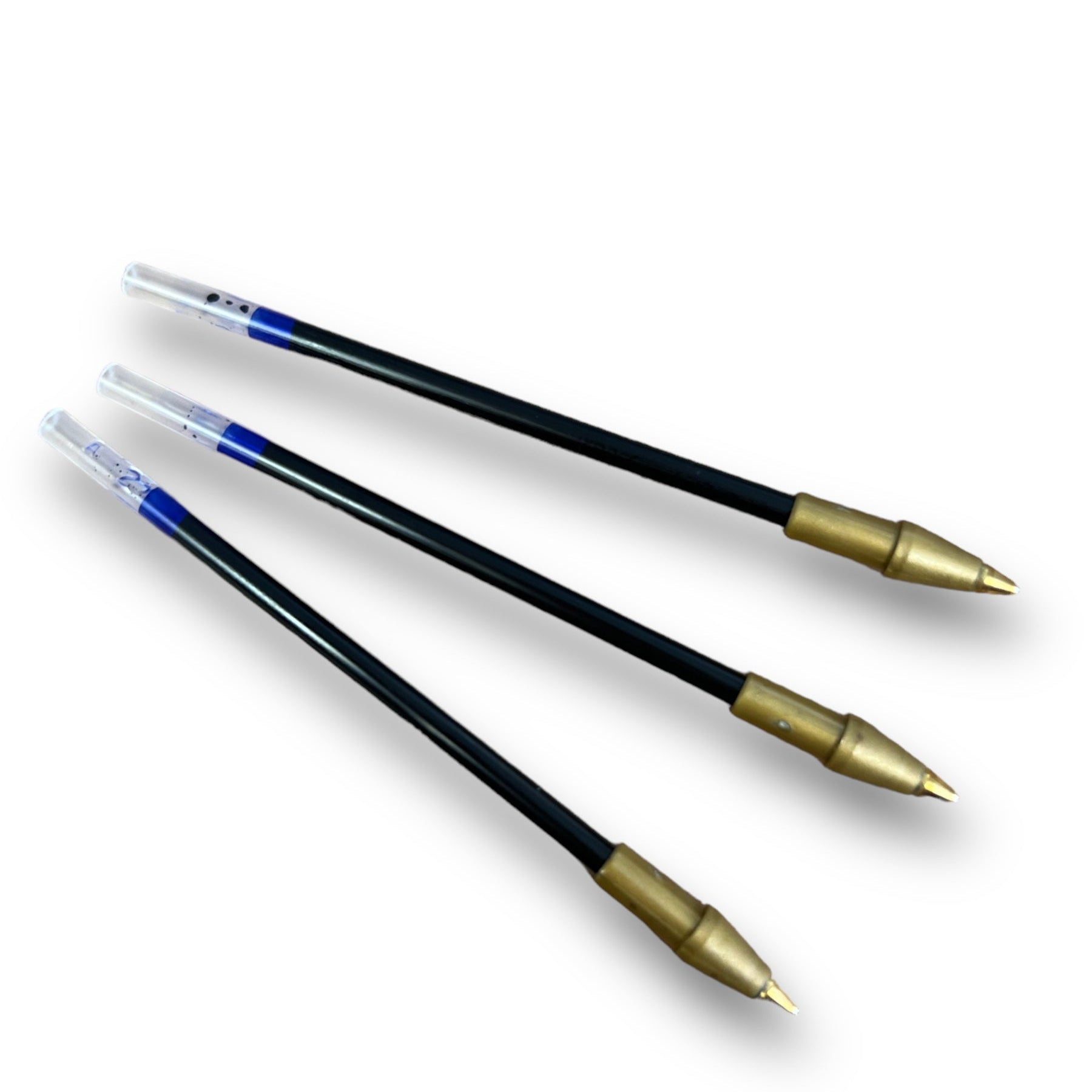 Three black ballpoint pen inserts with blue accents and gold-colored tips.