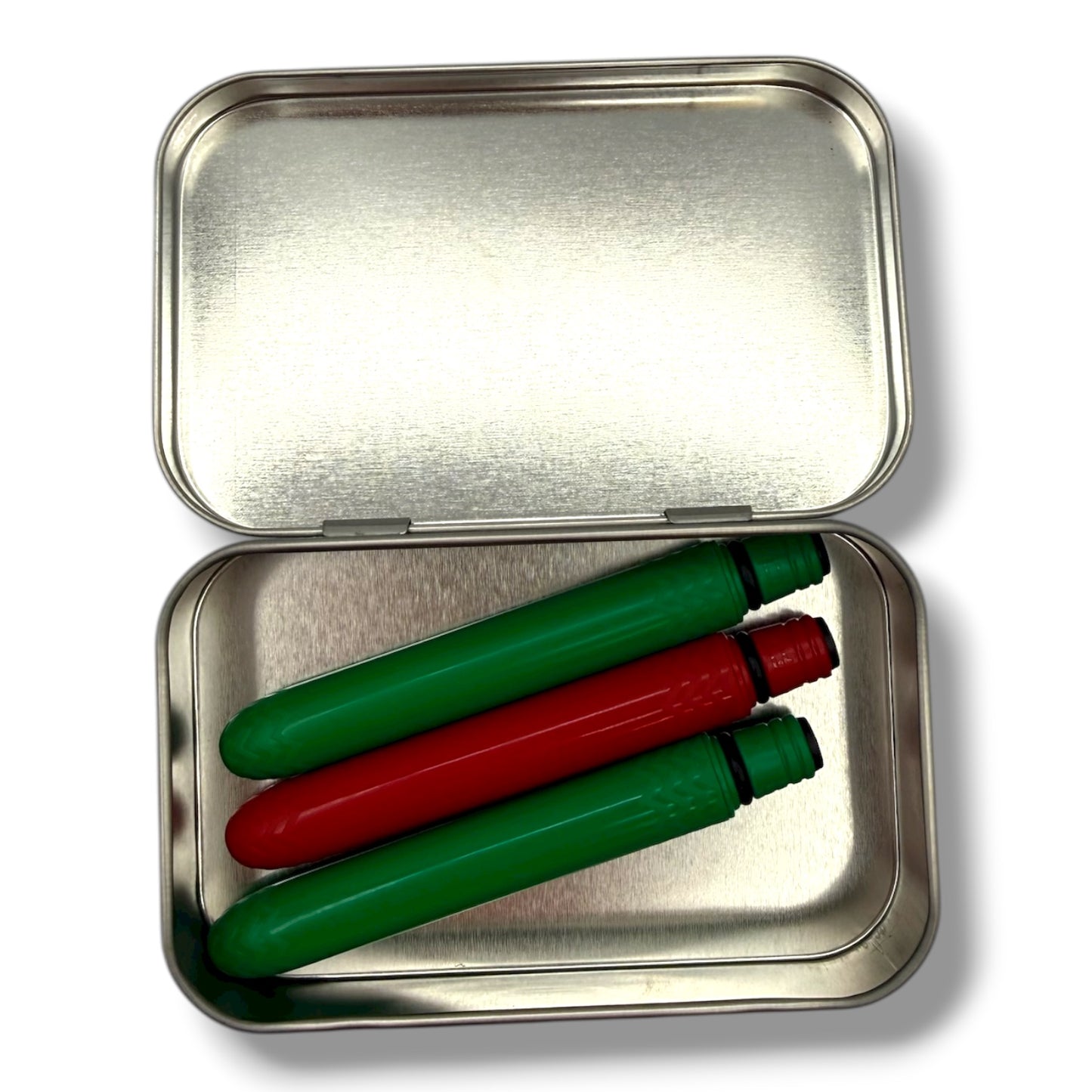 Metallic tin with green and red markers inside on a white background