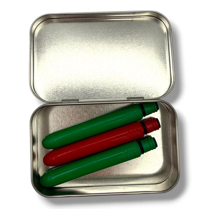 Metallic tin with green and red markers inside on a white background