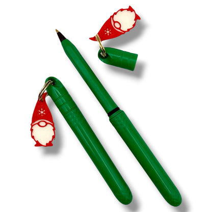 Green pen with Santa Claus-themed cap on a white background