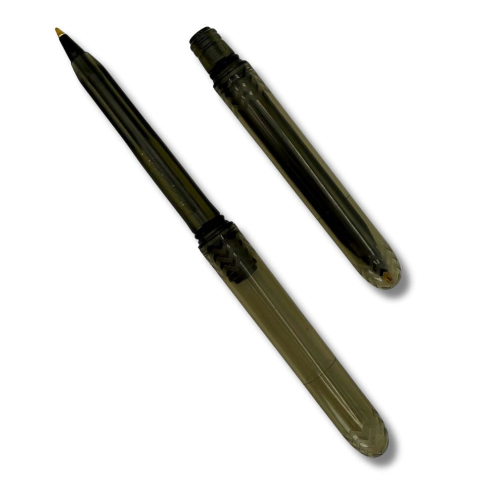Pen with a transparent body and black accents on a white background